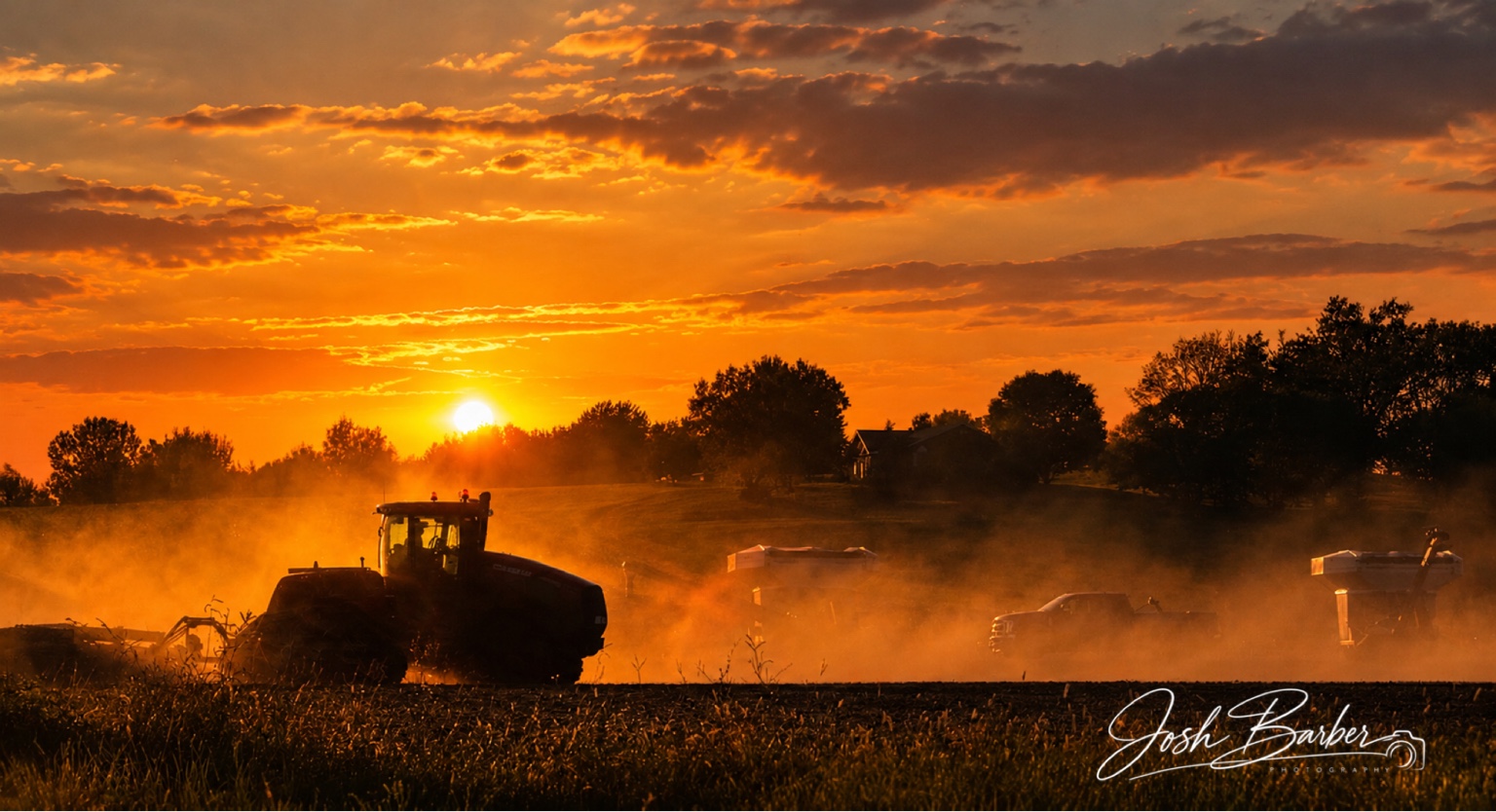 Harvest at sunset photographed by Josh Barber