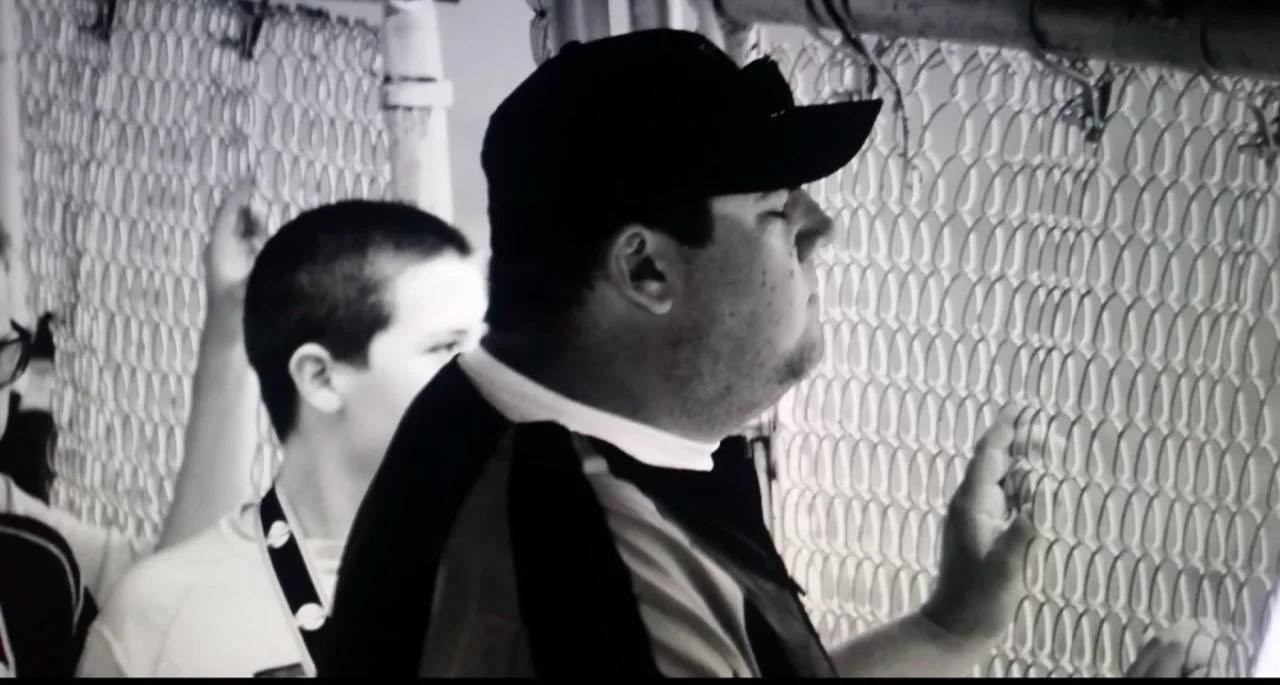 Black-and-white view from a baseball dugout